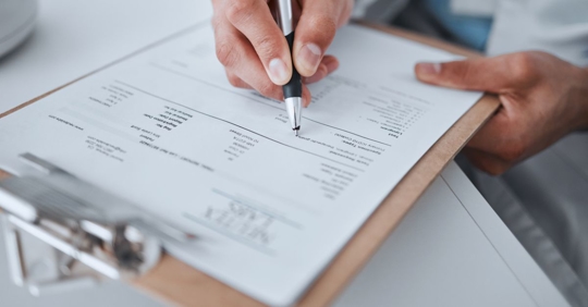 Doctor filling out forms for a patient who was in a car crash