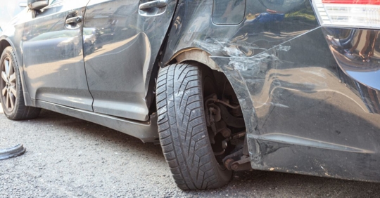 Rental car with bent wheel after an accident